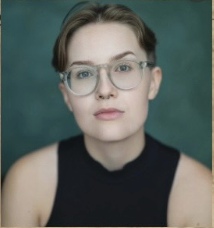 Maddie Gray as The Witness